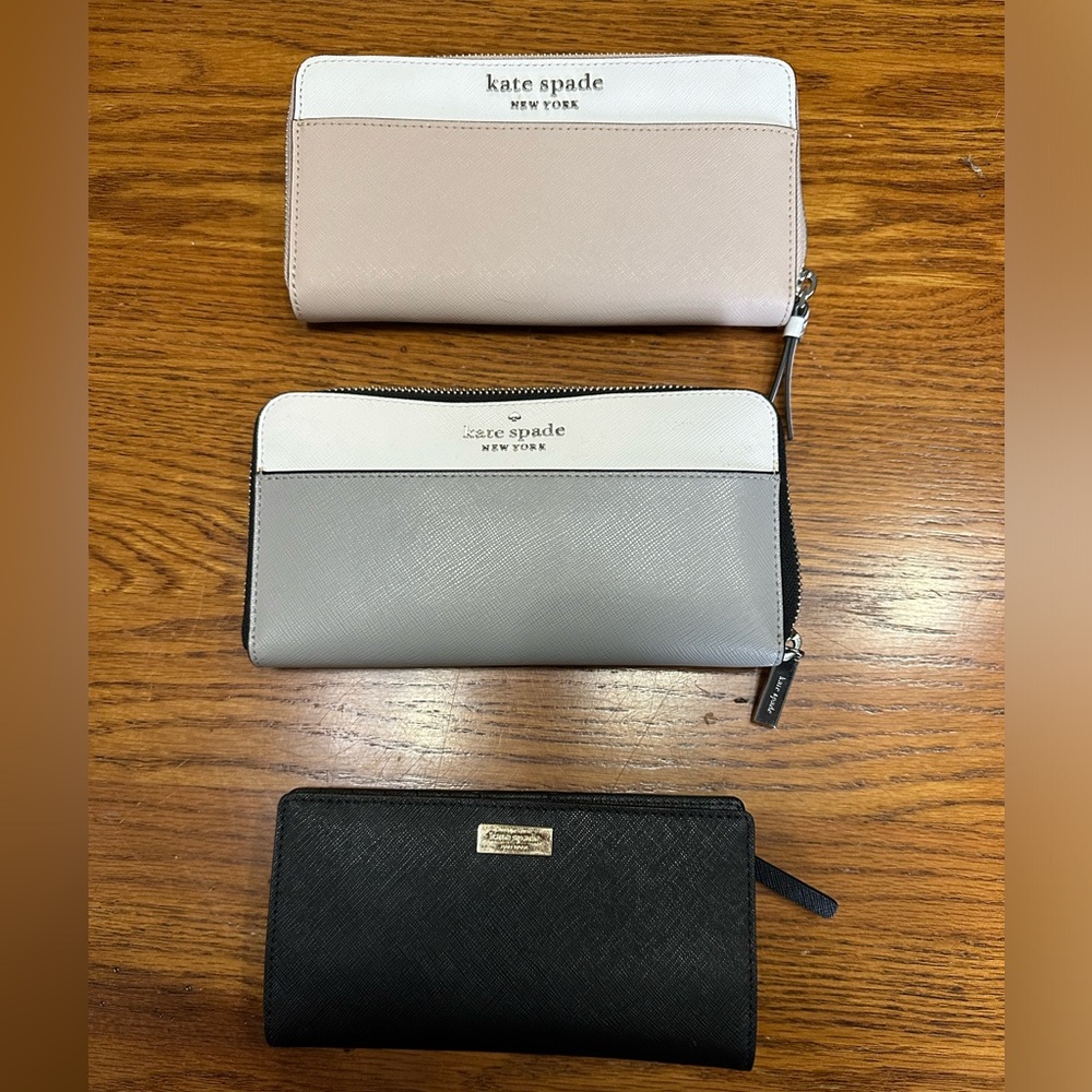 Three Kate spade wallets